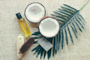Coconut oil being applied to hair for natural growth and thickness