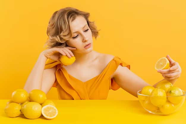 Woman applying lemon juice in her hair for lightening process